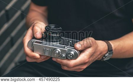 Close-up, Vintage Film Retro Camera In Male Hands.