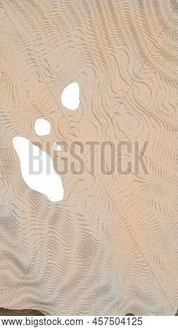 Light Brown Abstraction From Different Spots. On A Light Brown Background, There Are Several Bright 