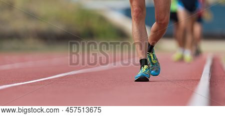 Athletes On Track In Race Walk Competition, Race Walking On Athletic Track