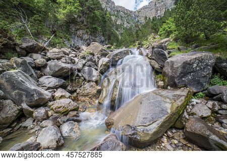 Long Exposure Of Cotatuero Waterfall And River In The Ordesa And Monte Perdido National Park.