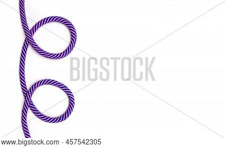 Multicolored Rope With Loops On A White Background And Free Space For Text. Decor In The Form Of A M