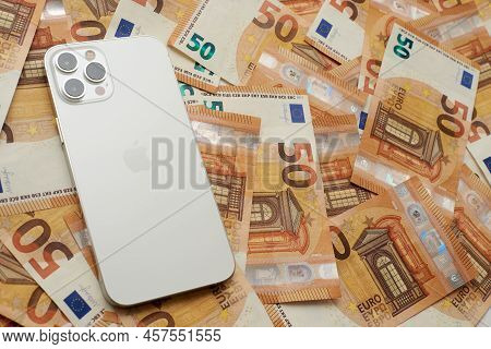 Stariy Oskol, Russia - July 5, 2021: New White Iphone On Euro Banknotes