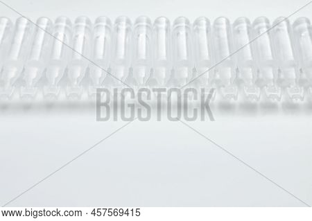 Single Dose Ampoules Of Sterile Isotonic Sea Water Solution On White Background. Space For Text