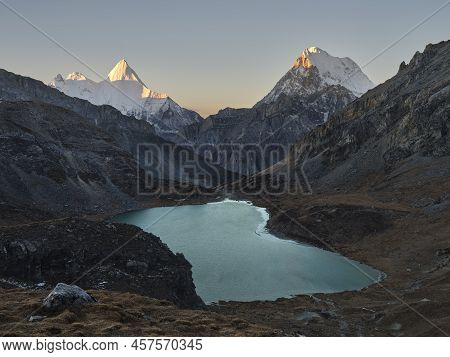 Mount Jampayang, Mount Chanadorje And Lake Boyongcuo At Sunrise In Yading National Park, Daocheng Co