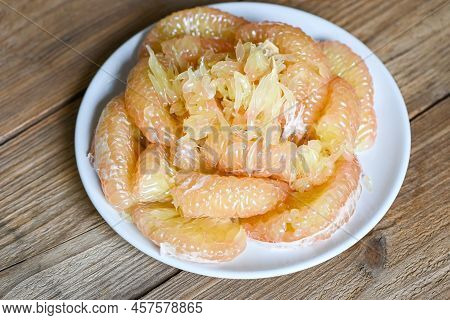 Pomelo Fruit On White Plate, Fresh Pomelo Peeled Frome Pomelo Tree , Pummelo , Grapefruit In Summer 