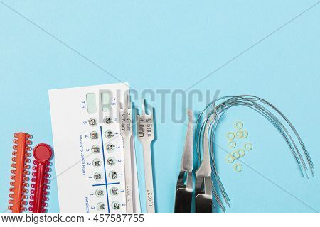 A Set Of Special Tools For An Orthodontist To Install Braces For A Patient. Orthodontic Arcs, Ligatu