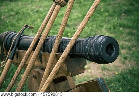 Vintage Swedish Cannons And Metal Cannonballs. Ancient Military Arsenal Of The Events Of The Russian