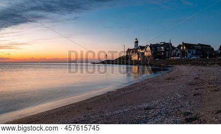 Urk Flevoland Netherlands Sunset At The Lighthouse And Harbor Of Urk Holland. Fishing Village Urk