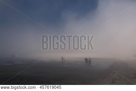 People Walkin On The The Wadden Sea