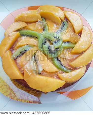 Glazed Fruit Flan Or Pie With Sliced Kiwi Fruit And Peach, Top View.