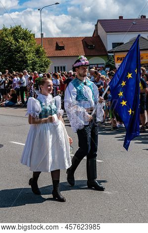 Boy And Girl With The Eu Flag In Folk Costumes