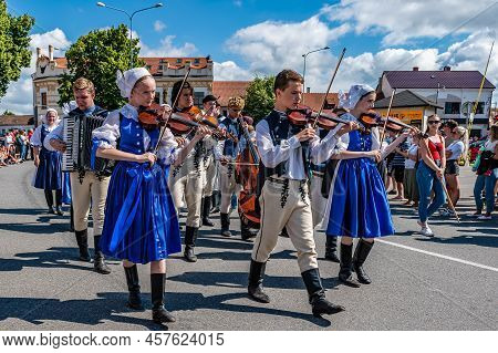 Folk Music In Regional Costumes In Parade