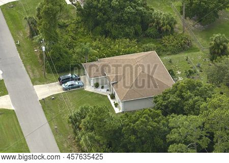 Aerial View Of Typical Contemporary American Private House With Roof Top Covered With Asphalt Shingl