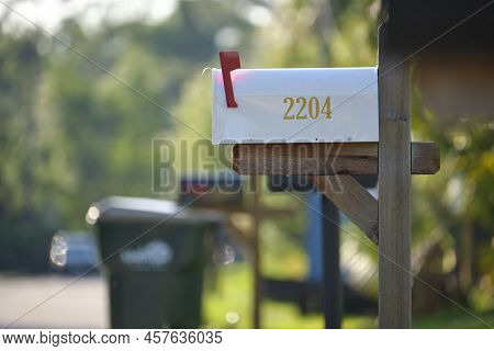 Typical American Outdoors Mail Box On Suburban Street Side