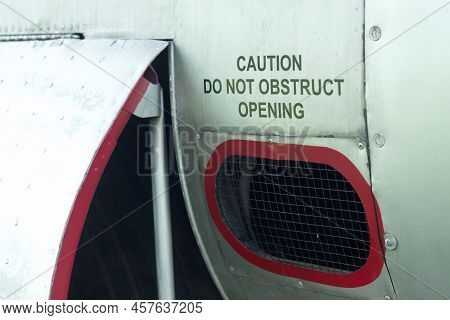 Caution Do Not Obstruct Opening Decal On An Old Aircraft.
