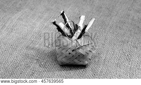 Neem Tree Branches Pieces On Jute Fabric Background. Neem Stems Use As Ayurveda Medicine. Neem Branc