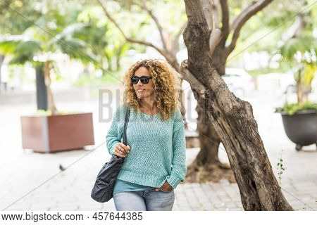 Beautiful Cheerful Happy Cauacsian Woman Walk In The Outdoor Park - People And Leisure Activity - Po