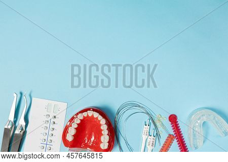 A Set Of Special Tools For An Orthodontist To Install Braces For A Patient. Orthodontic Arcs, Ligatu