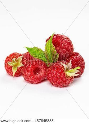 Ripe Raspberries With Leaves Isolated On White Background