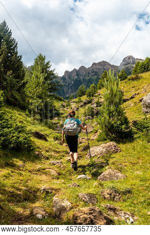 A Hiker On The Trek To The Piedrafita Arch In The Pyrenees In Panticosa, Aragon