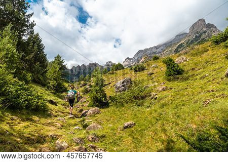 A Hiker On The Trek To The Piedrafita Arch In The Pyrenees In Panticosa, Aragon
