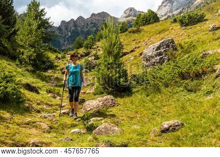 A Hiker On The Trek To The Piedrafita Arch In The Pyrenees In Panticosa, Aragon