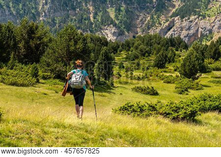 A Young Woman Climbing The Mountain To The Piedrafita Arch, Alto Gallego, Huesca, Aragon
