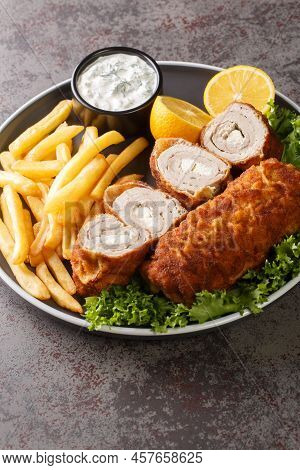 Karageorge Schnitzel Serbian Stuffed Cutlet Served With French Fries And Tartar Sauce Close-up In A 
