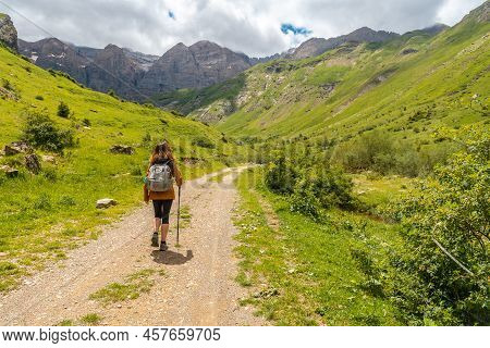 A Hiker In The Ripera Valley In The Town Of Panticosa In The Pyrenees. Huesca