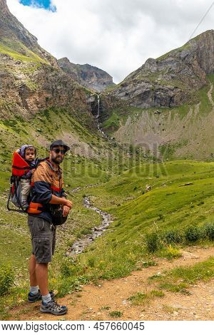 A Young Man Next To The Salto De Tendenera Waterfall In The Ripera Valley, Panticosa, Pyrenees