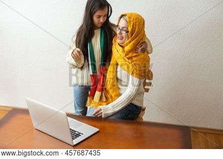 Arab Mother With Her Daughter On White Background