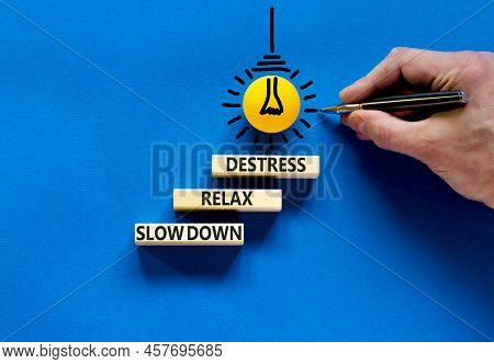 Destress Symbol. Concept Words Slow Down Relax Destress On Wooden Blocks. Beautiful Blue Table Blue 