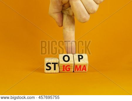 Stop Stigma Symbol. Concept Words Stop Stigma On Wooden Cubes. Businessman Hand. Beautiful Orange Ta