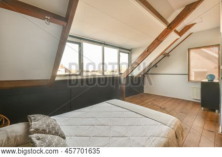 Mansard Bedroom With Minimalist Interior Design 47 6 Comfortable Bed Placed Near Green Wall In Moder