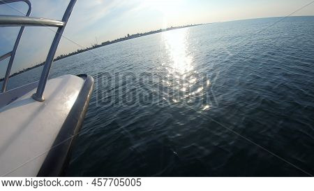 Seascape, View Of Sea Waves With Sun Reflection From Prow Of Motorboat. Boat Jumping On Waves On Sun