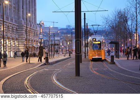 Tram At A Stop In The City Center In The Evening