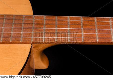 Fragment Of The Fingerboard With Frets Of Old Traditional Wooden Acoustic Guitar With Six Strings, C