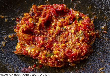 Fresh Sambal Served On Stone Mortar (cobek). Sambal Is Traditional Sauce From Indonesia Made From Ch
