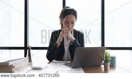 Image Of An Asian Woman Who Is Tired And Overthinking From Working With A Tablet At The Office.