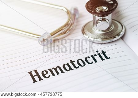 On An Open Notebook Is Stethoscope And Printed Text Hematocrit On Table In Doctor Office