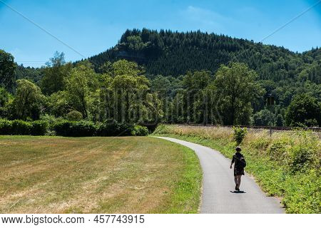 Woman Walking Along The Railway Tracks Towards Trier, Kordel, Germany
