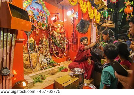 Kolkata, West Bengal, India - 5th July 2017 : Hindu Priest Blessing Devotees Visiting Lord Hanuman J