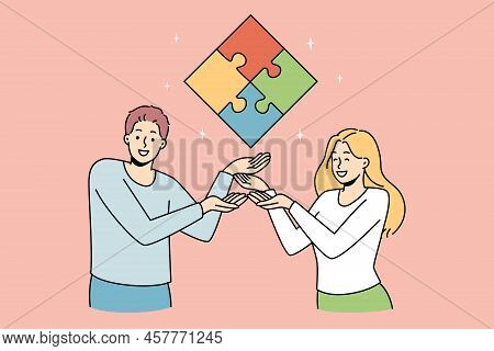 Happy Businesspeople Showing Jigsaw Puzzle Coming To Shared Business Conclusion Or Solution. Smiling