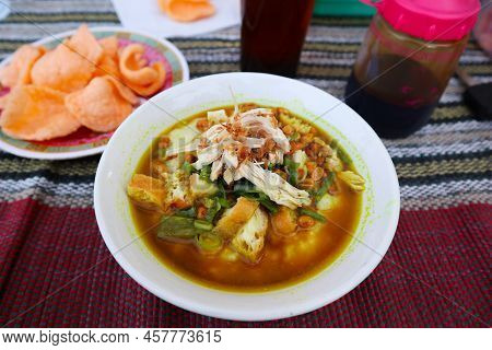 Bubur Ayam Or Chicken Porridge Or Rice Gruel, Made From Served With Shredded Chicken, Leek Slice, Be