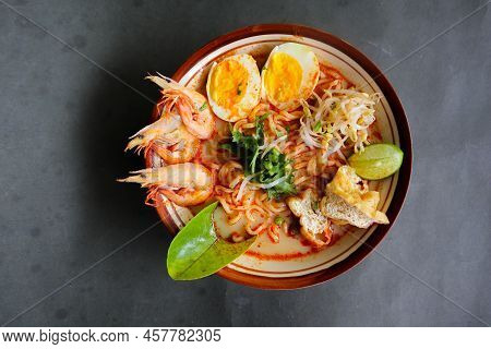 Laksa, Laksa Curry Made From Vermicelli, Noodles, Bean Sprouts, Egg, Tofu Lime, And Shrimp With A Sp
