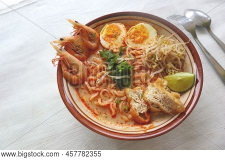 Laksa, Laksa Curry Made From Vermicelli, Noodles, Bean Sprouts, Egg, Tofu Lime, And Shrimp With A Sp