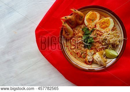 Laksa, Laksa Curry Made From Vermicelli, Noodles, Bean Sprouts, Egg, Tofu Lime, And Shrimp With A Sp