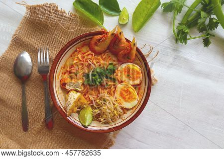 Laksa, Laksa Curry Made From Vermicelli, Noodles, Bean Sprouts, Egg, Tofu Lime, And Shrimp With A Sp
