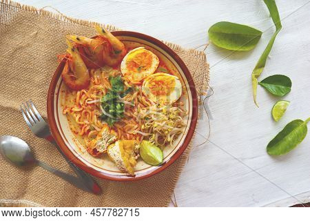 Laksa, Laksa Curry Made From Vermicelli, Noodles, Bean Sprouts, Egg, Tofu Lime, And Shrimp With A Sp