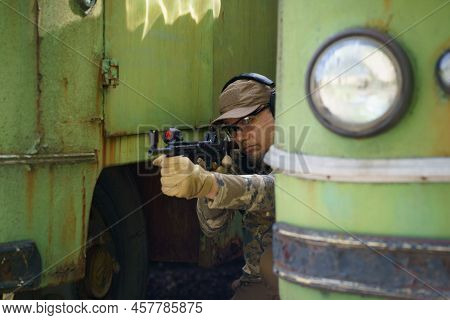 Civil Disturbance Training, Man In Tactical Training Course Hide Behind Old Rusty Vehicles. Police M